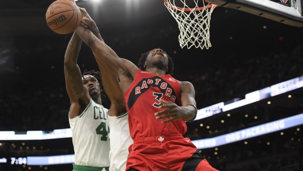 Oct 9, 2021; Boston, Massachusetts, USA; Toronto Raptors forward OG Anunoby (3) has the ball knocked away by Boston Celtics center Robert Williams III (44) during the first half at TD Garden. Mandatory Credit: Bob DeChiara-USA TODAY Sports
